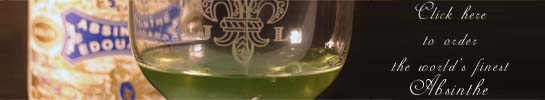 closeup picture of a glass of jade absinthe